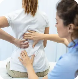 Chiropractor in Athens, Georgia adjusting patient’s back for pain relief.